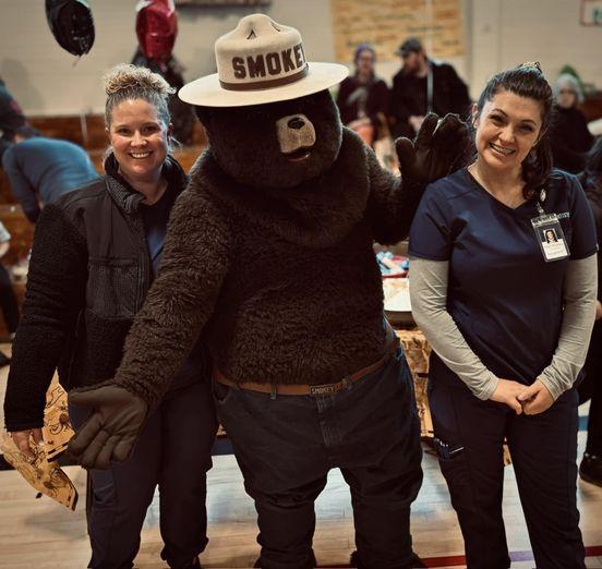 The Advantage Dental Community Care Team with Smokey Bear.